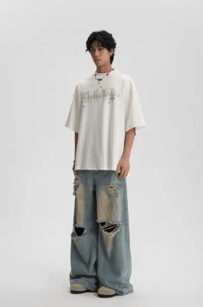 Distressed And Ripped Baggy Jeans With Washed Effect